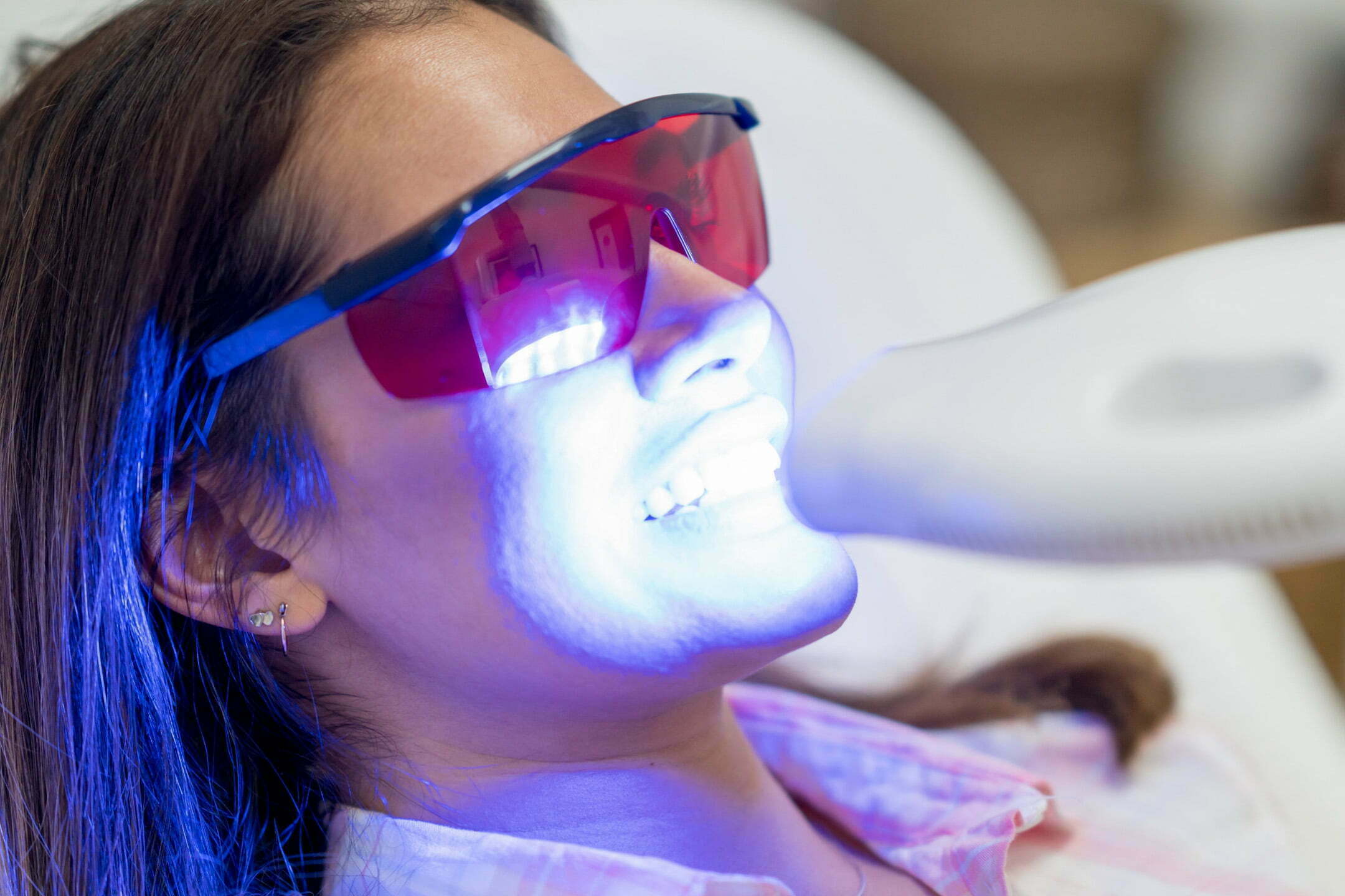 Patient receiving teeth whitening treatment