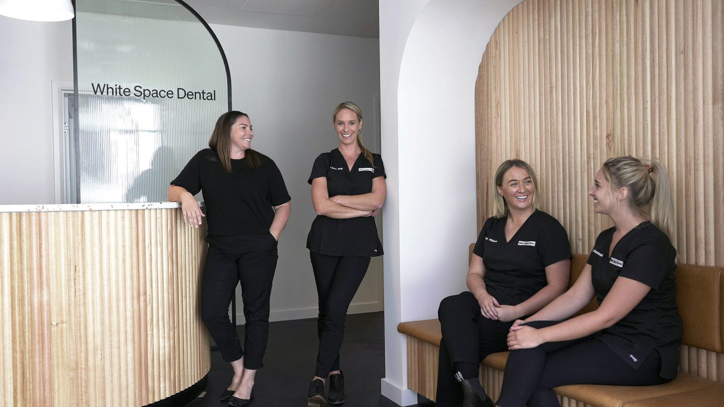 Laura and the White Space Dental team in the lobby