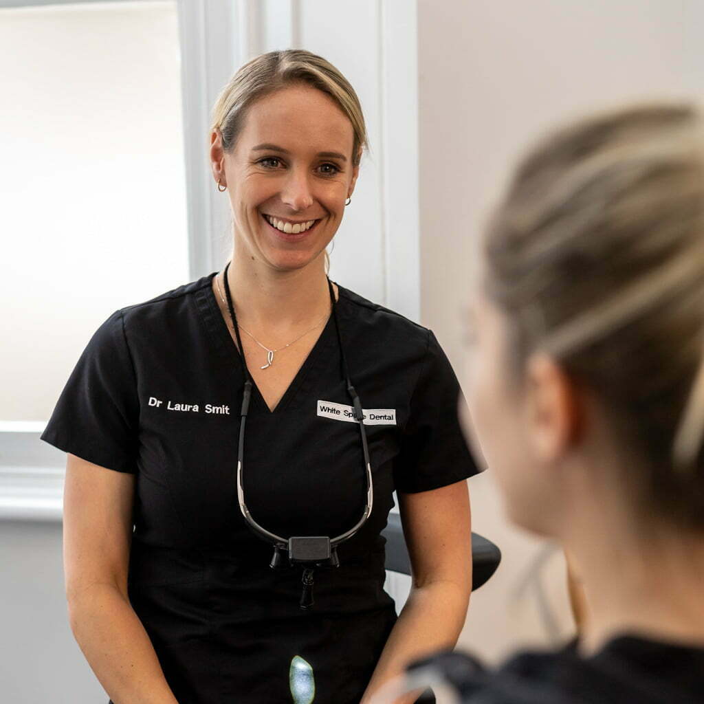 Laura smiling with patient